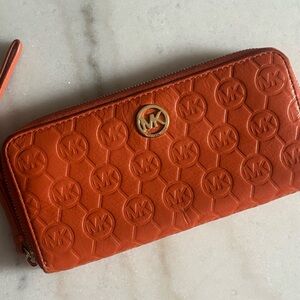 Michael Kors Orange Embossed Leather Zip Around Wallet Gold Logo
